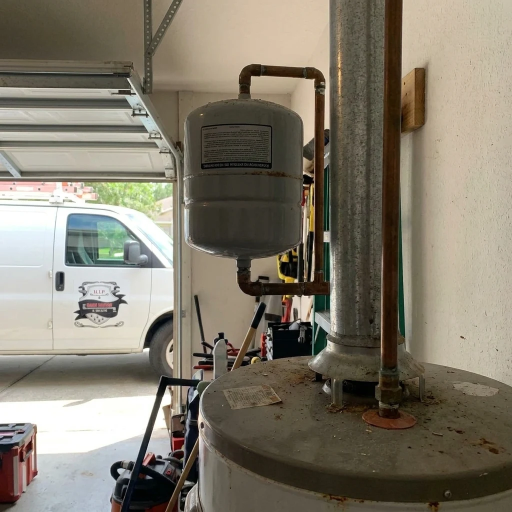 Expansion tank being installed on a water heater supply line