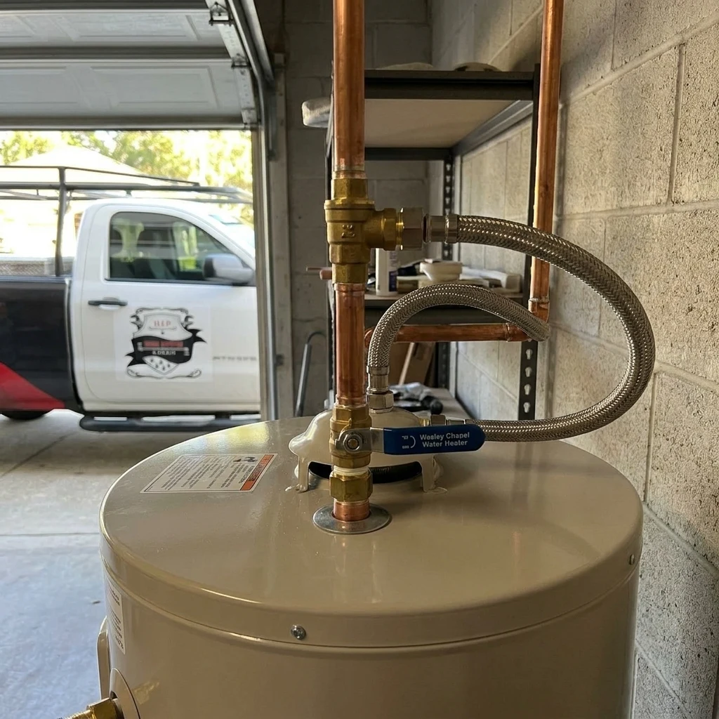 Close-up of a tank water heater installation, typical of Valrico replacements
